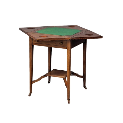 1030 - An Edwardian inlaid mahogany envelope turnover games table. 53.5x77.5cm