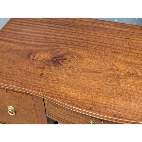 1031 - An Early 20th Century Sheraton Revival inlaid mahogany Serpentine front desk / side table. 122x57.5x... 