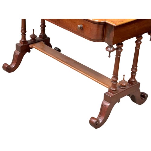 1043 - A Victorian mahogany 2 drawer side table on cabriole legs. Circa 1870. 106x53x72cm