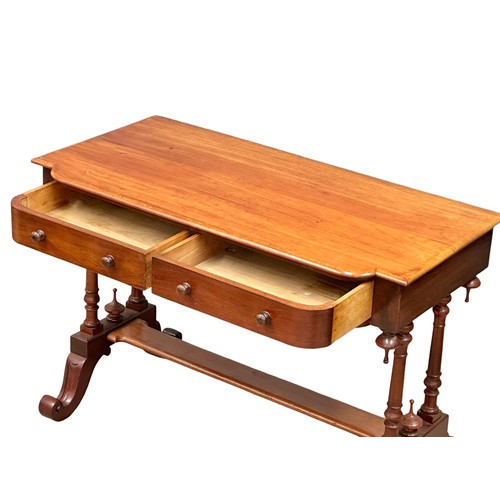 1043 - A Victorian mahogany 2 drawer side table on cabriole legs. Circa 1870. 106x53x72cm