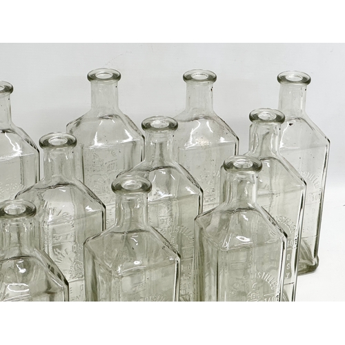 697 - A collection of 15 vintage The Old Bushmill’s Distillery Triple Distilled whiskey bottles. 24.5cm