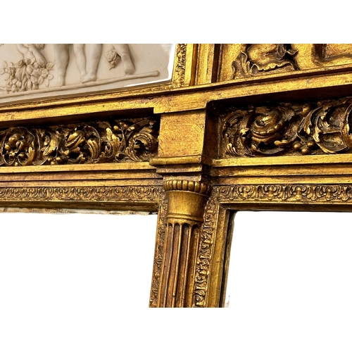 1051 - A very large 18th Century style French gilt mirror back console table with marble top, cherub and cu... 