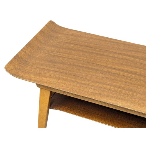 1055 - A 1960s Mid Century teak 2 tiered coffee table. 82x38x43cm