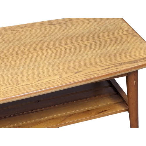 1056 - A Mid Century 2 tiered coffee table. 104.5x43x39cm