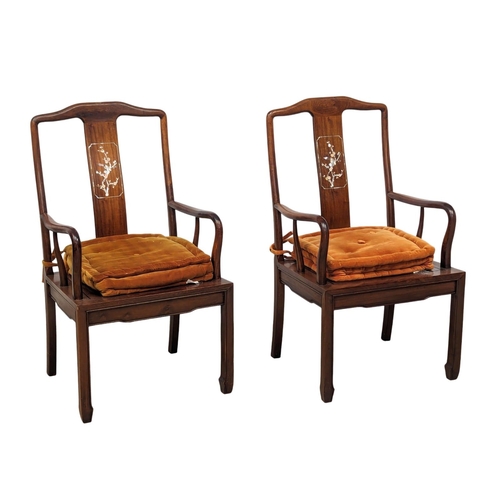 1057 - A Chinese rosewood 2 leaf extending dining table and 6 chairs with Mother of Pearl inlay.