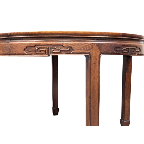 1057 - A Chinese rosewood 2 leaf extending dining table and 6 chairs with Mother of Pearl inlay.