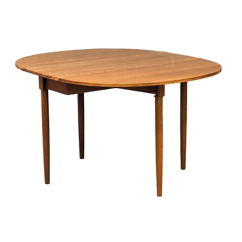 960 - A G-Plan Mid Century teak drop leaf dining. Extended 132x108x72.5cm