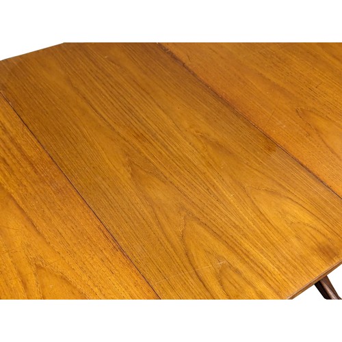 1058 - A Mid Century teak extending dining table by Beithcraft. Extended 213.5x92x76cm