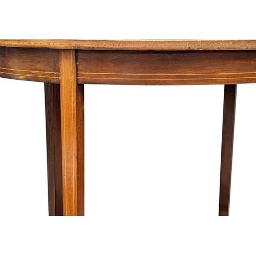 1065 - An Edwardian inlaid mahogany side table. 65x47x72cm