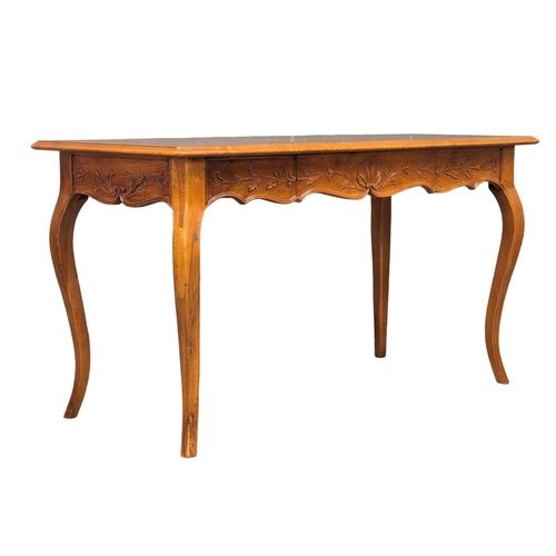 1074 - An Italian provincial cherrywood console table/writing table with drawer, on cabriole legs. 134cm x ... 