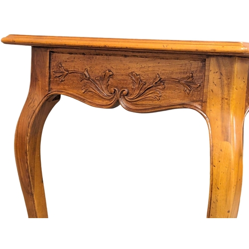 1074 - An Italian provincial cherrywood console table/writing table with drawer, on cabriole legs. 134cm x ... 