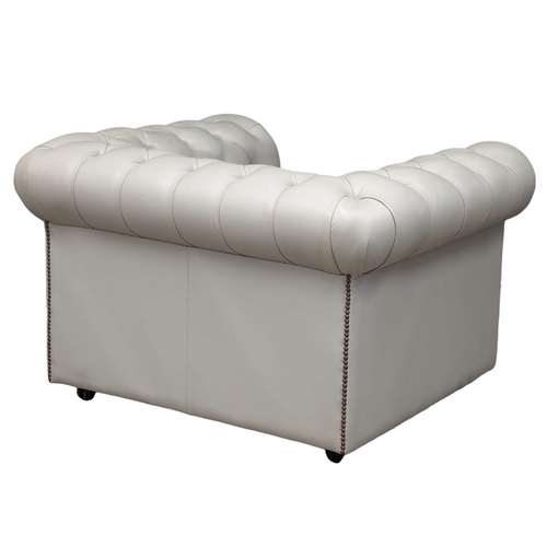 1075 - A deep button club style armchair