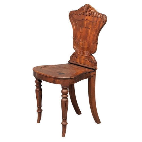 1078 - An early William IV ornate mahogany hall chair