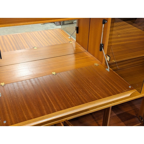 1084 - A large Mid Century teak 2 piece living room unit, by Morris of Glasgow. 183x48x171.5cm