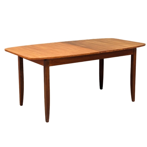 1089 - A mid century teak table and 6 chairs, 168cm x 89cm x 75cm. Extended 211cm x 89cm x 75cm