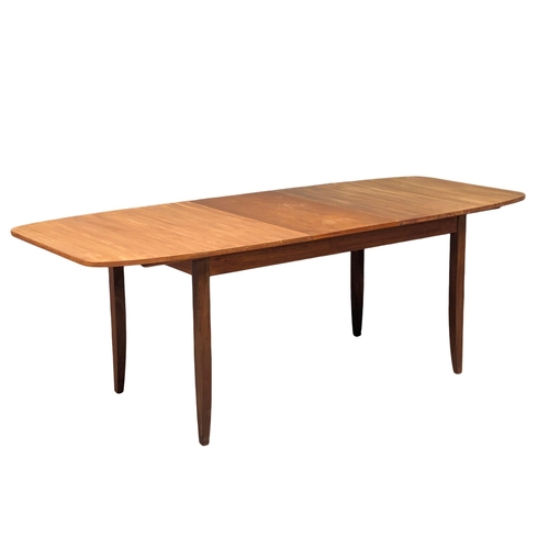 1089 - A mid century teak table and 6 chairs, 168cm x 89cm x 75cm. Extended 211cm x 89cm x 75cm