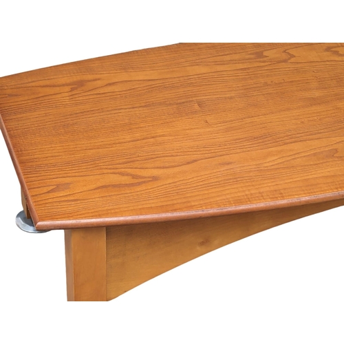 1091 - A Mid Century teak coffee table on chromed feet. 113.5x62x36cm