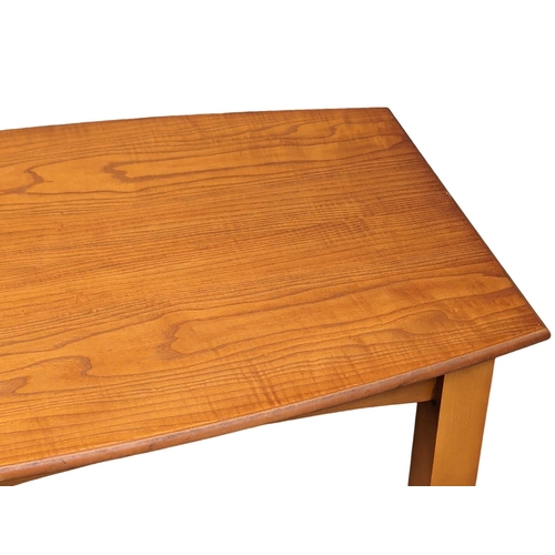 1091 - A Mid Century teak coffee table on chromed feet. 113.5x62x36cm