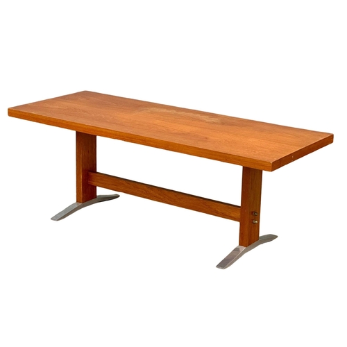 1094 - A Danish Mid Century teak coffee table on chromed feet. 120x48x44cm