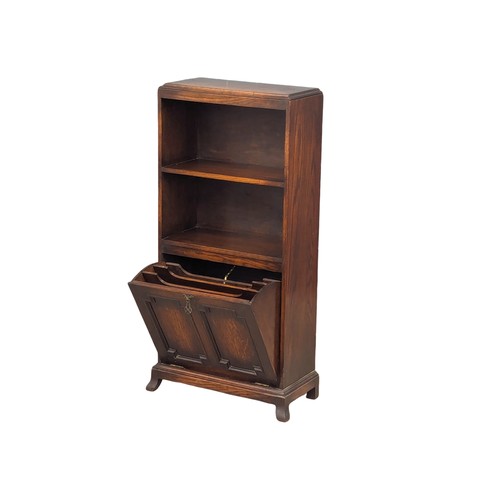 1106 - A vintage oak open bookcase with drop down paper rack. 48.5x22.5x105cm