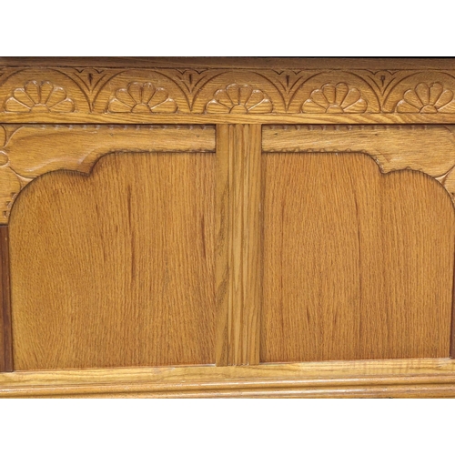 1107 - An oak hall bench. 89x36x74cm