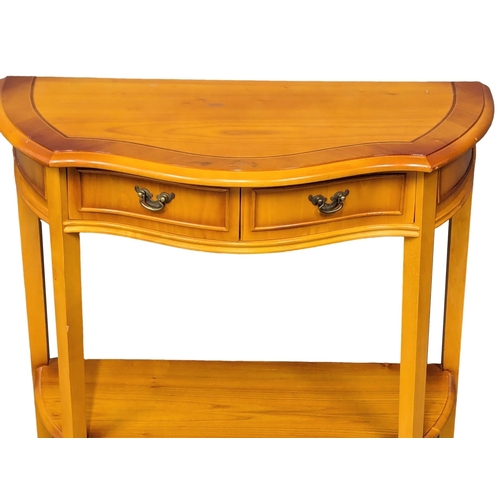 1109 - A yew wood Serpentine front hall table with 2 drawers. 72x35x75xm