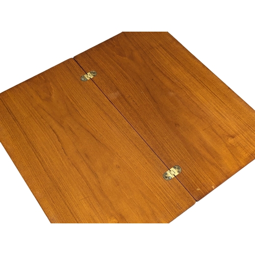 1111 - A McIntosh Mid Century teak 'Triform' turnover coffee table. 76x41x64cm