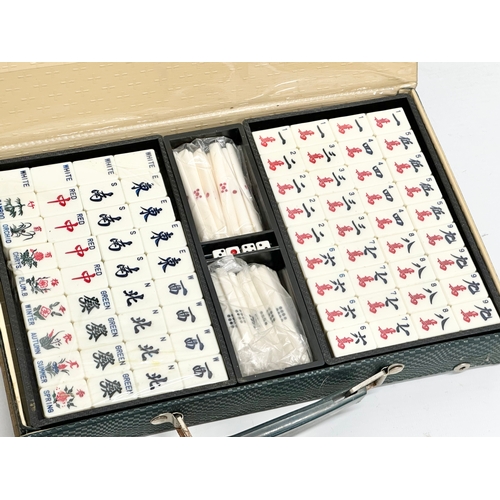 700 - 3 Chinese Mahjong sets in cases.