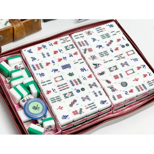 700 - 3 Chinese Mahjong sets in cases.