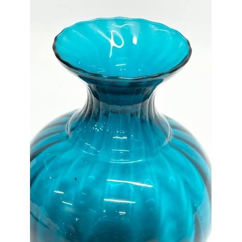 765 - A Mid 20th Century blue swirl glass vases. 16x20cm