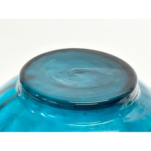 765 - A Mid 20th Century blue swirl glass vases. 16x20cm