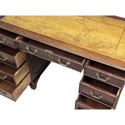 1131 - A George III style mahogany leather top desk, 118cm x 60cm x 77cm