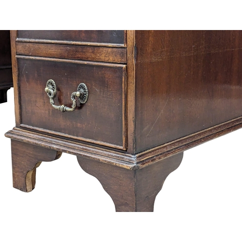 1131 - A George III style mahogany leather top desk, 118cm x 60cm x 77cm