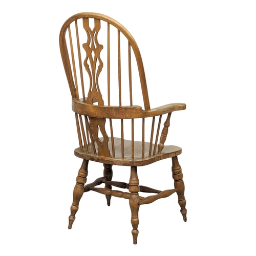 1123 - A 19th Century style Windsor armchair.