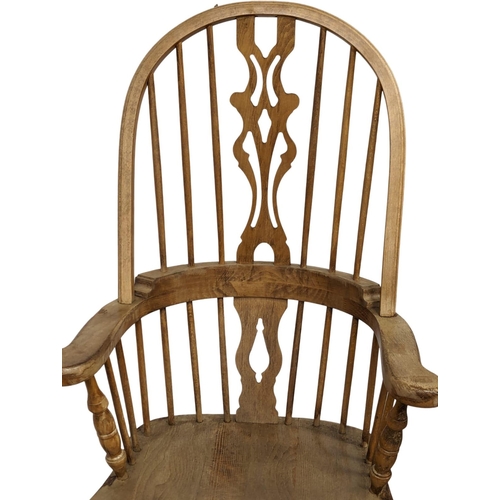 1123 - A 19th Century style Windsor armchair.