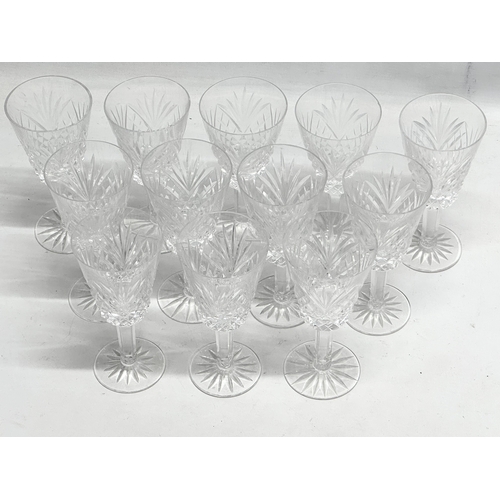 766 - A set of 12 crystal wine glasses. 16.5cm