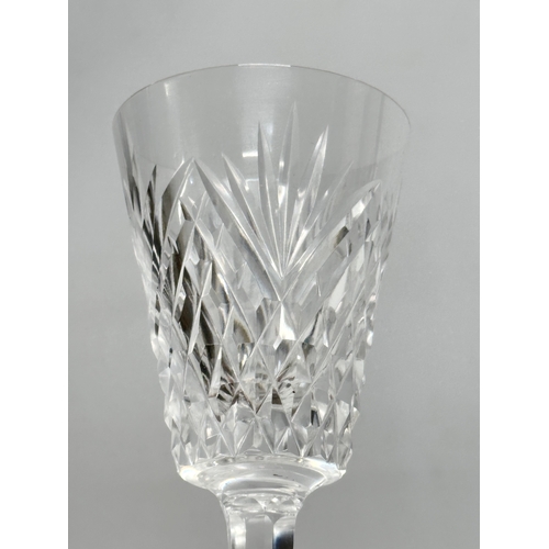 766 - A set of 12 crystal wine glasses. 16.5cm