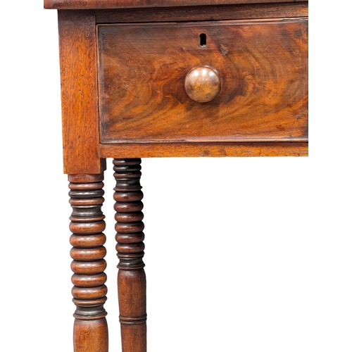 1144 - A George IV mahogany side table with 3 drawers and reeded legs. Circa 1820. 102x45x83cm