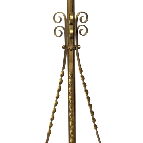 1138 - A large Early 20th Century telescopic brass standard lamp on brass lion paw feet. 180cm