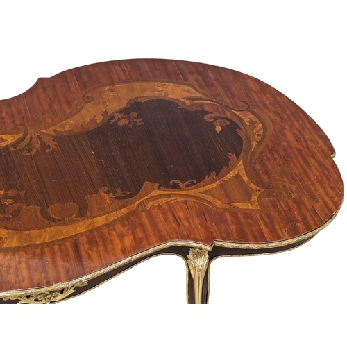 1145 - An Italian inlaid coffee table with brass mounts. 115x67x46cm