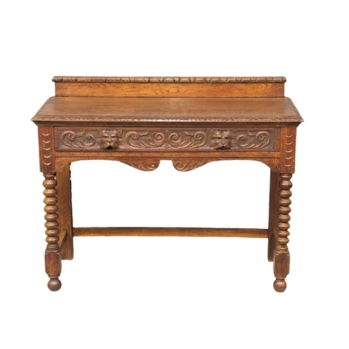 1134 - A late Victorian carved oak hall table with bobbin turn legs and Man Of The Forest handles, 107cm x ... 