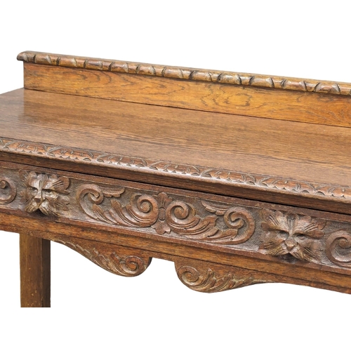 1134 - A late Victorian carved oak hall table with bobbin turn legs and Man Of The Forest handles, 107cm x ... 