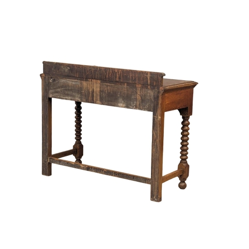 1134 - A late Victorian carved oak hall table with bobbin turn legs and Man Of The Forest handles, 107cm x ... 