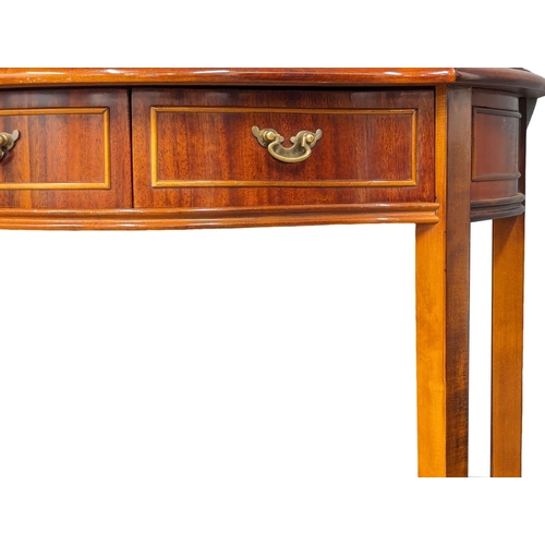 1148 - An inlaid serpentine front side table with 2 drawers. 71x35x75.5cm