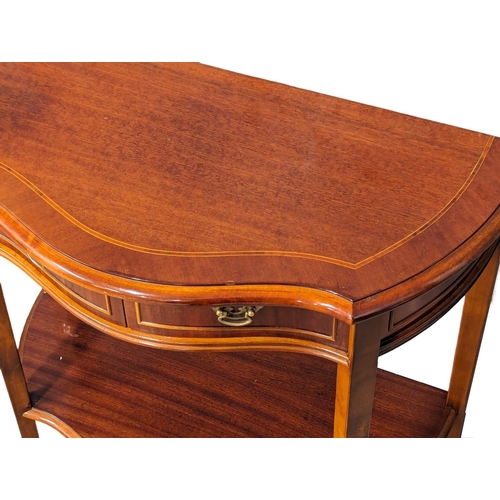 1148 - An inlaid serpentine front side table with 2 drawers. 71x35x75.5cm