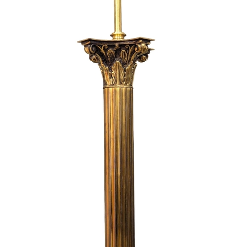 1150 - A brass Corinthian style standard lamp. 140cm