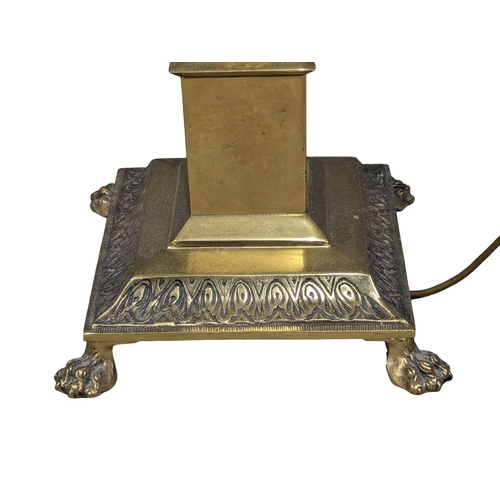 1150 - A brass Corinthian style standard lamp. 140cm