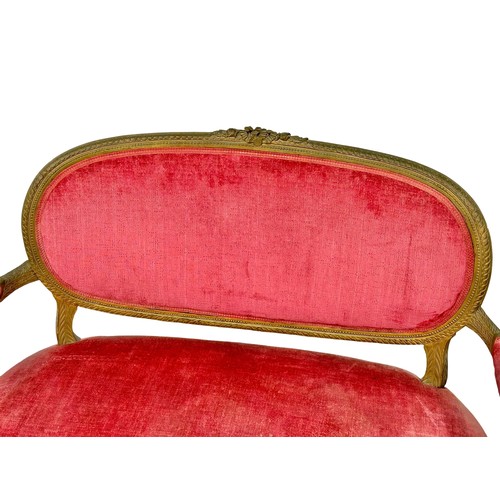 1152 - An Early 20th Century French gilt wood framed 2 seater sofa. Circa 1910-1920.