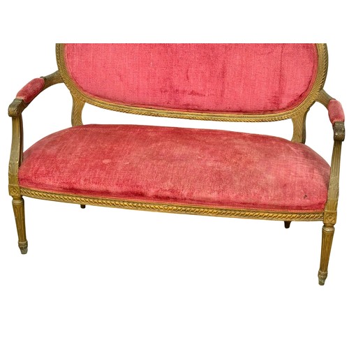 1152 - An Early 20th Century French gilt wood framed 2 seater sofa. Circa 1910-1920.