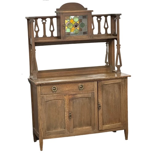 1153 - An Early 20th Century Arts & Crafts oak mirror back sideboard with stained glass panel door. Circa 1... 